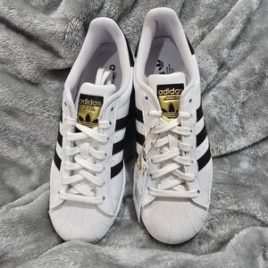 Adidas Men's White and Black Sneakers with Gold Accents